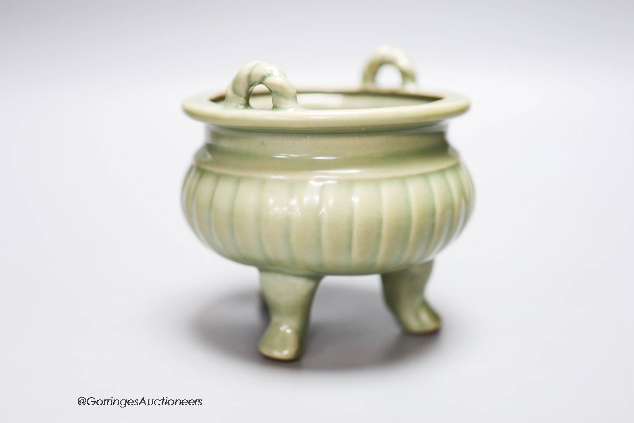 A Chinese celadon tripod censer, height 11.5cm